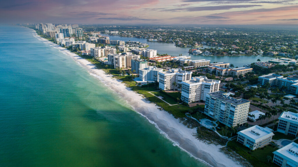 Naples, Florida coastal cityscape and luxury real estate market for business sales
